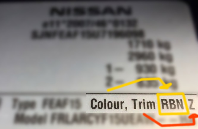 Nissan paint code label on the vehicle – find your exact color match.